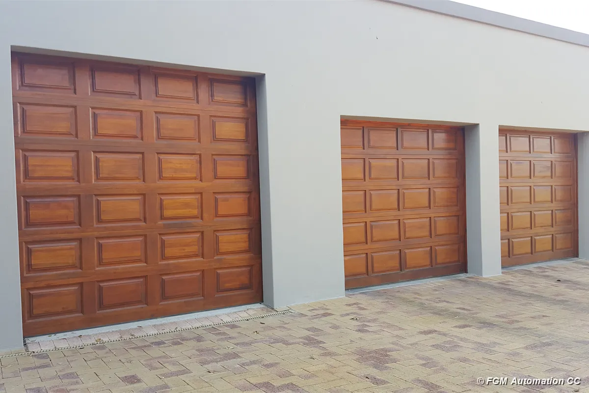 Three wooden sectional garage doors in different sizes